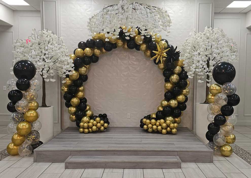 gold-and-black-balloons-stage